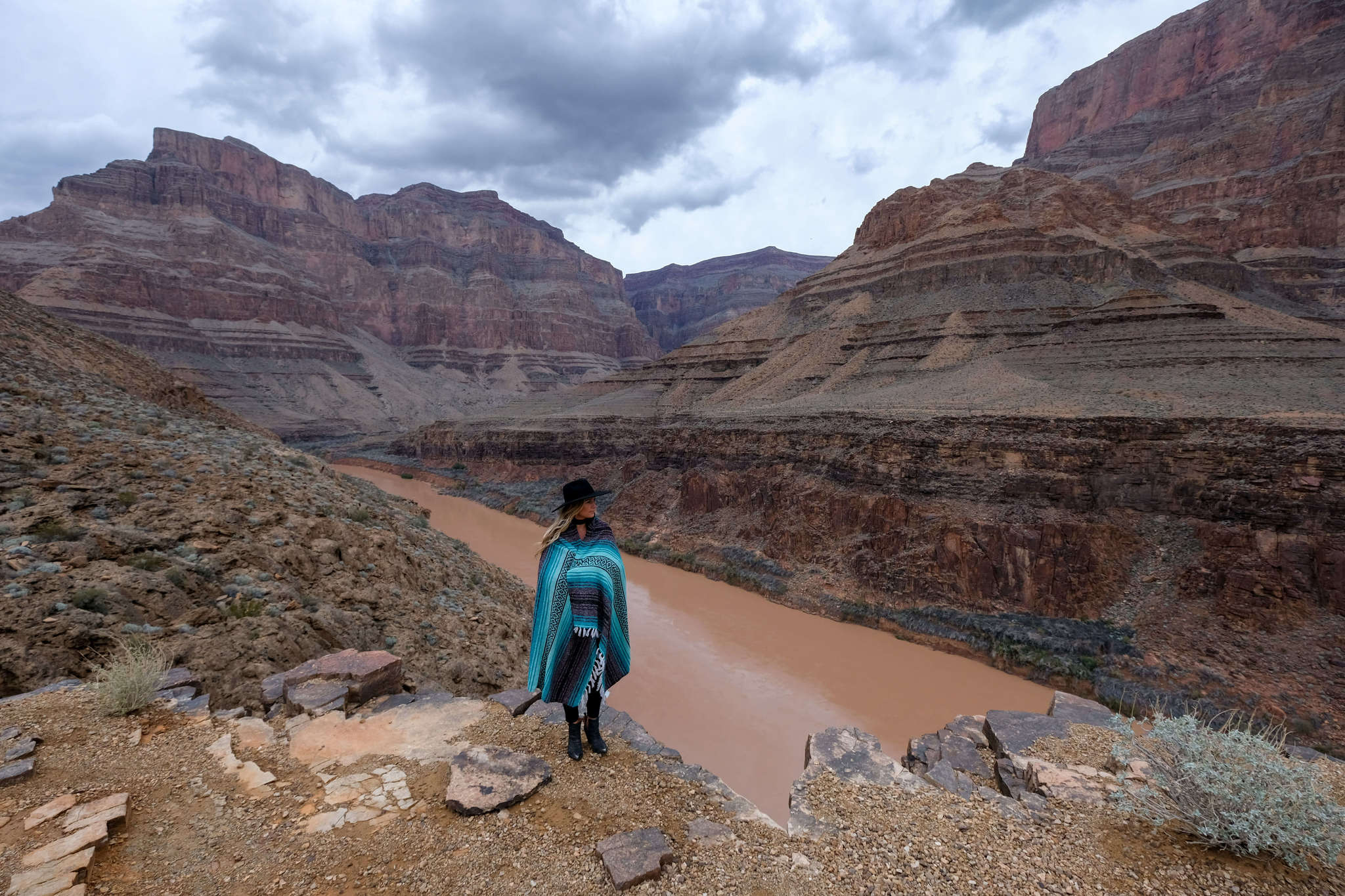 blonde looking over grand canyon